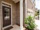 Welcoming front door with sidelights, brick facade, and the house number prominently displayed at 203 Holden Way, Woodstock, GA 30189