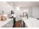 Contemporary kitchen featuring white cabinets, spacious countertops and stainless steel appliances at 203 Holden Way, Woodstock, GA 30189