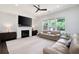 Inviting living room with fireplace, large windows, and comfortable seating at 203 Holden Way, Woodstock, GA 30189