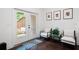 Cozy seating area leading to a backyard view through glass doors at 203 Holden Way, Woodstock, GA 30189