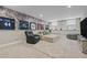 Finished basement with a comfortable seating area, stylish wallpaper, and sports-themed decor at 2118 Harmony Dr, Canton, GA 30115