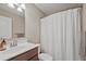 Bathroom featuring a single sink vanity and shower with curtain at 2118 Harmony Dr, Canton, GA 30115