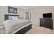 Bedroom features a dark wood bed frame, dresser, and decorative wall art at 2118 Harmony Dr, Canton, GA 30115