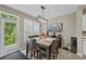 Cozy dining area with a view to the backyard, featuring a modern light fixture and decorative wall art at 2118 Harmony Dr, Canton, GA 30115
