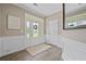 Inviting foyer with wood flooring, white trim, and a stylish front door and wreath that adds a touch of elegance at 2118 Harmony Dr, Canton, GA 30115