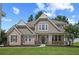 Charming two-story home featuring a brick and shingle facade with a covered porch and well-manicured lawn at 2118 Harmony Dr, Canton, GA 30115