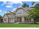 Charming two-story home featuring a brick and shingle facade with a covered porch and well-manicured lawn at 2118 Harmony Dr, Canton, GA 30115