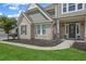 Charming two-story home featuring a brick and shingle facade with a covered porch and well-manicured lawn at 2118 Harmony Dr, Canton, GA 30115