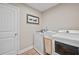 Functional laundry room with front load washer and dryer at 2118 Harmony Dr, Canton, GA 30115