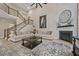 Spacious living room with soaring ceilings, fireplace, staircase and stylish decor at 2118 Harmony Dr, Canton, GA 30115