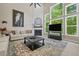 Spacious living room with soaring ceilings, fireplace, large windows, and stylish decor at 2118 Harmony Dr, Canton, GA 30115