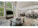 Open-concept living area featuring a wall of windows with access to the kitchen and dining area at 2118 Harmony Dr, Canton, GA 30115