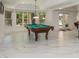 Spacious basement featuring a pool table and walkout access to the backyard and view of the neighborhood at 2461 Oak Grove Ne Ests, Atlanta, GA 30345