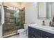 Updated bathroom featuring a glass shower, modern vanity, and stylish fixtures at 2461 Oak Grove Ne Ests, Atlanta, GA 30345