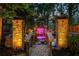 Outdoor water feature with a bridge, colorful lights, and stone pillars at 2461 Oak Grove Ne Ests, Atlanta, GA 30345
