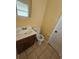 Bathroom with tile flooring, wood vanity, and neutral walls at 2670 Foxlair Trl, South Fulton, GA 30349
