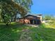 Home exterior with mature trees and a covered carport at 2670 Foxlair Trl, South Fulton, GA 30349