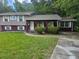 Charming two-story home with a well-maintained lawn, brick accents, and inviting front entrance at 2670 Foxlair Trl, South Fulton, GA 30349