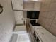 Modern kitchen featuring white cabinets and updated appliances at 2670 Foxlair Trl, South Fulton, GA 30349