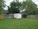 Large backyard with mature trees and a privacy fence at 4517 Baker Grove Nw Rd, Acworth, GA 30101