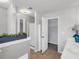 Bright bathroom view with walk in shower, shelving and modern finishes at 4517 Baker Grove Nw Rd, Acworth, GA 30101