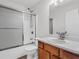 Bathroom featuring a shower with glass doors, a single sink, and a wood cabinet at 4517 Baker Grove Nw Rd, Acworth, GA 30101