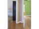 Bright bedroom showcasing hardwood floors, a closet, and neutral wall colors at 4517 Baker Grove Nw Rd, Acworth, GA 30101