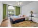 Cozy bedroom with a large window, hardwood floor, and comfortable inflatable bed at 4517 Baker Grove Nw Rd, Acworth, GA 30101