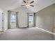 Spacious bedroom with carpeted floors, ceiling fan and lots of natural light at 4517 Baker Grove Nw Rd, Acworth, GA 30101