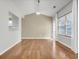 Open dining room with hardwood floors and bright natural light streaming in at 4517 Baker Grove Nw Rd, Acworth, GA 30101