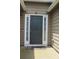 Close-up of a traditional front door with white trim and a welcome mat at 4517 Baker Grove Nw Rd, Acworth, GA 30101