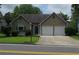 Lovely home with a manicured lawn, a two-car garage, and a charming front porch at 4517 Baker Grove Nw Rd, Acworth, GA 30101