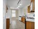 Kitchen featuring updated appliances, wooden cabinets and tile floors at 4517 Baker Grove Nw Rd, Acworth, GA 30101