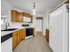 Updated kitchen with white countertops, wooden cabinets and tile flooring at 4517 Baker Grove Nw Rd, Acworth, GA 30101