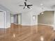 Open-concept living area with hardwood floors, fan, and windows with natural light at 4517 Baker Grove Nw Rd, Acworth, GA 30101