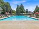 A large, refreshing swimming pool with lounge chairs for relaxation and enjoyment at 4517 Baker Grove Nw Rd, Acworth, GA 30101