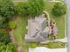 Aerial view of a well-maintained home with a pristine roof, mature trees, and manicured landscaping at 1360 Wilmington Way, Grayson, GA 30017