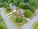 Aerial view of an attractive neighborhood with well-manicured lawns and mature trees in a suburban setting at 1360 Wilmington Way, Grayson, GA 30017