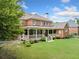 Large backyard with a lush lawn, a patio and mature trees; perfect for Gathering gatherings and outdoor enjoyment at 1360 Wilmington Way, Grayson, GA 30017