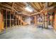 Unfinished basement with exposed framework and concrete floors, presenting an opportunity for personalization at 1360 Wilmington Way, Grayson, GA 30017