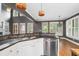 Stylish kitchen with stainless steel appliances, granite counters, and views of the outdoor space at 1360 Wilmington Way, Grayson, GA 30017