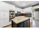 Well-equipped kitchen with stainless appliances, granite countertops, and an island workstation at 1360 Wilmington Way, Grayson, GA 30017
