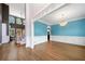 Bright open-concept living space featuring hardwood floors, crown molding and elegant chandelier at 1360 Wilmington Way, Grayson, GA 30017