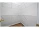 Walk-in closet with metal shelving and laminate floors at 1360 Wilmington Way, Grayson, GA 30017