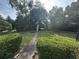 Fenced backyard featuring a well-maintained lawn and a patio table, perfect for outdoor activities at 1610 Sprayberry Dr, Marietta, GA 30066