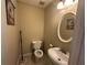 Cozy half bathroom features a white sink and toilet at 1610 Sprayberry Dr, Marietta, GA 30066