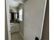 Bathroom doorway showing vanity with granite counters and framed mirror at 1610 Sprayberry Dr, Marietta, GA 30066