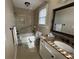 Tiled bathroom with shower-tub combo and a granite countertop vanity at 1610 Sprayberry Dr, Marietta, GA 30066