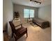 Simple bedroom with track lighting, twin bed, and comfortable striped chair at 1610 Sprayberry Dr, Marietta, GA 30066