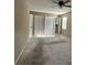 Large carpeted bedroom with ceiling fan and spacious closets for storage at 1610 Sprayberry Dr, Marietta, GA 30066